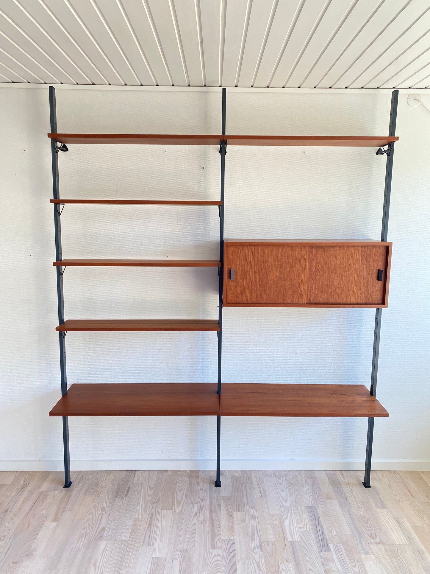 Mid Century, modular teak wall shelf by Olof Pira for String, 1950s