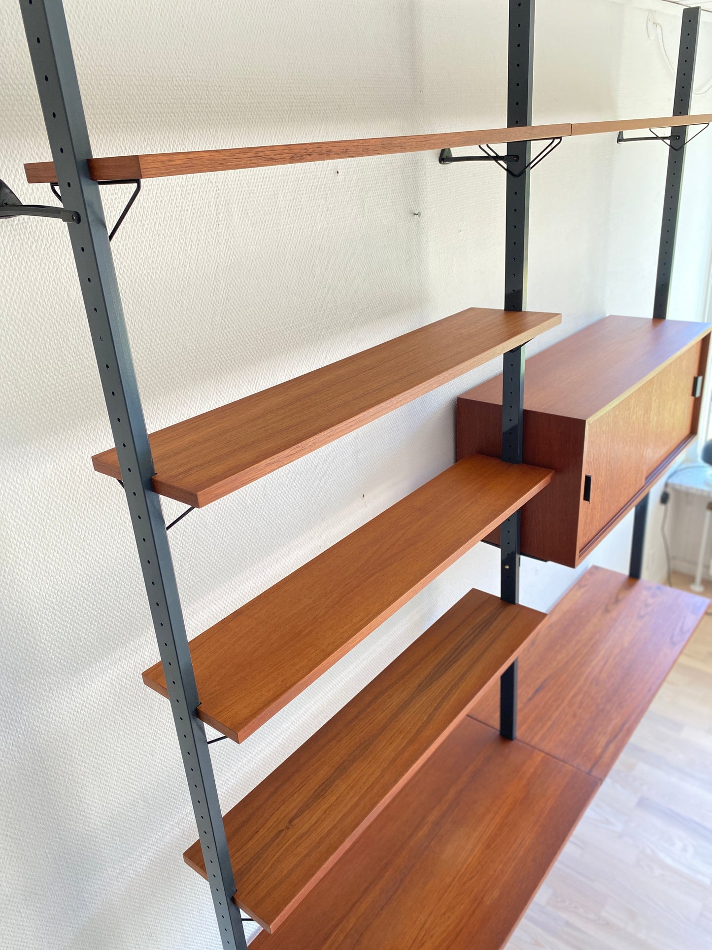 Mid Century, modular teak wall shelf by Olof Pira for String, 1950s