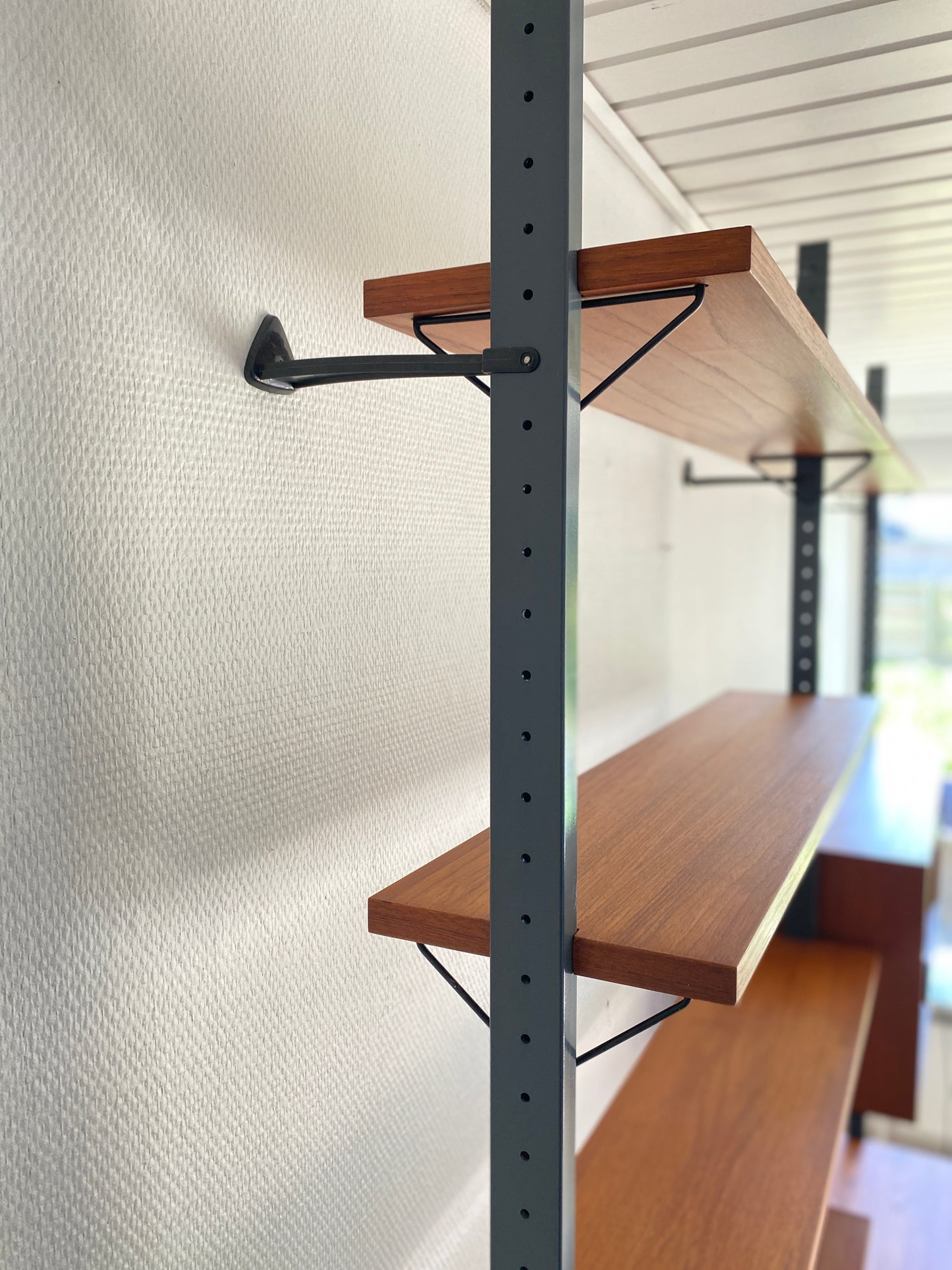 Mid Century, modular teak wall shelf by Olof Pira for String, 1950s